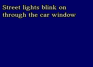 Street lights blink on
through the car window