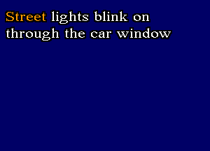 Street lights blink on
through the car window
